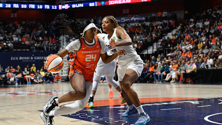 Sep 10, 2025; Uncasville, Connecticut, USA; Connecticut Sun forward Aneesah Morrow (24) drives to the basket against Atlanta Dream forward Naz Hillmon (00) during the second half at Mohegan Sun Arena. Sep 10, 2025; Uncasville, Connecticut, USA; Connecticut Sun forward Aneesah Morrow (24) drives to the basket against Atlanta Dream forward Naz Hillmon (00) during the second half at Mohegan Sun Arena.