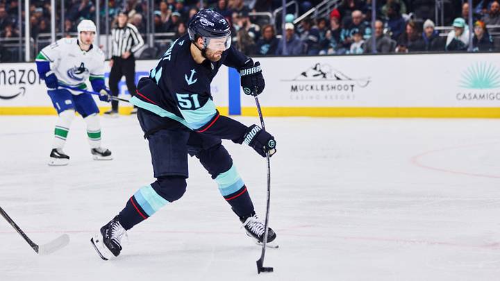 Feb 28, 2026; Seattle, Washington, USA;  Seattle Kraken center Shane Wright (51) takes a shot on goal during the second period against the Vancouver Canucks at Climate Pledge Arena. Mandatory Credit: Blake Dahlin-Imagn Images