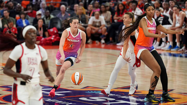 Jul 20, 2024; Phoenix, AZ, USA; Team WNBA forward Angel Reese (5) sets a pick for Team WNBA guard Caitlin Clark (22) during the WNBA All Star Game