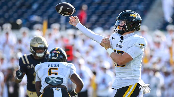 Sep 5, 2026; Annapolis, Maryland, USA;  Towson Tigers quarterback Andrew Indorf (13) throws during the first half against the Navy Midshipmen at Navy-Marine Corps Memorial Stadium. Mandatory Credit: Tommy Gilligan-Imagn Images