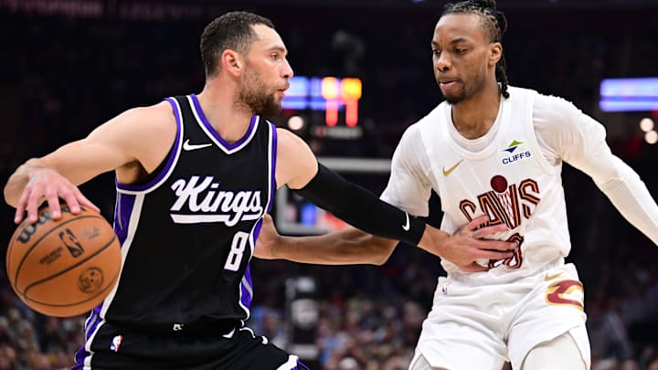 Apr 6, 2025; Cleveland, Ohio, USA; Sacramento Kings guard Zach LaVine (8) drives to the basket against Cleveland Cavaliers guard Darius Garland (10) during the first half at Rocket Arena. Mandatory Credit: Ken Blaze-Imagn Images