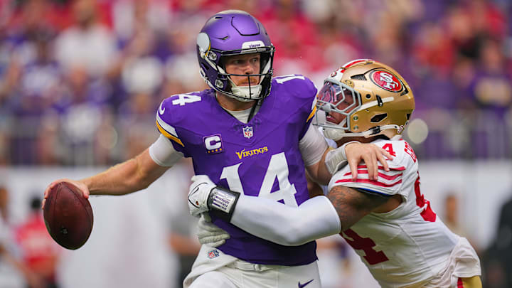 Sep 15, 2024; Minneapolis, Minnesota, USA; San Francisco 49ers defensive end Yetur Gross-Matos (94) tackles Minnesota Vikings quarterback Sam Darnold (14) in the third quarter at U.S. Bank Stadium. Mandatory Credit: Brad Rempel-Imagn Images