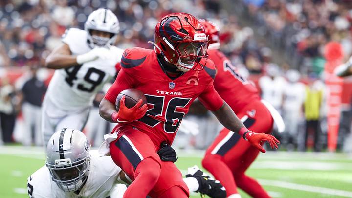 Dec 21, 2025; Houston, Texas, USA; Houston Texans running back Jawhar Jordan (26) rushes against Las Vegas Raiders linebacker Elandon Roberts (52) during the first quarter at NRG Stadium. Mandatory Credit: Troy Taormina-Imagn Images Dec 21, 2025; Houston, Texas, USA; Houston Texans running back Jawhar Jordan (26) rushes against Las Vegas Raiders linebacker Elandon Roberts (52) during the first quarter at NRG Stadium. Mandatory Credit: Troy Taormina-Imagn Images