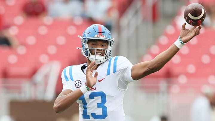 Nov 2, 2024; Fayetteville, Arkansas, USA; Ole Miss Rebels quarterback Austin Simmons (13) during the fourth quarter against the Arkansas Razorbacks at Donald W. Reynolds Razorback Stadium. Mississippi won 63-31. Mandatory Credit: Nelson Chenault-Imagn Images