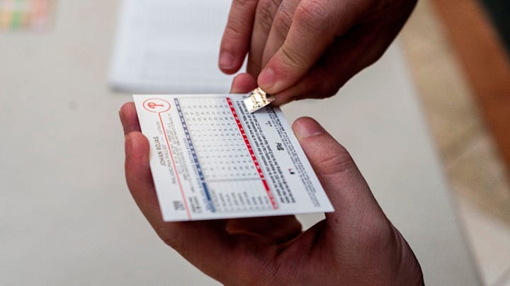 Vince Diiorio puts an authentication sticker on the back of an autographed Johan Rojas baseball card at Dynasty Sports & Framing’s meet and greet event in the Oxford Valley Mall in Langhorne on Thursday, July 25, 2024. Vince Diiorio puts an authentication sticker on the back of an autographed Johan Rojas baseball card at Dynasty Sports & Framing’s meet and greet event in the Oxford Valley Mall in Langhorne on Thursday, July 25, 2024.