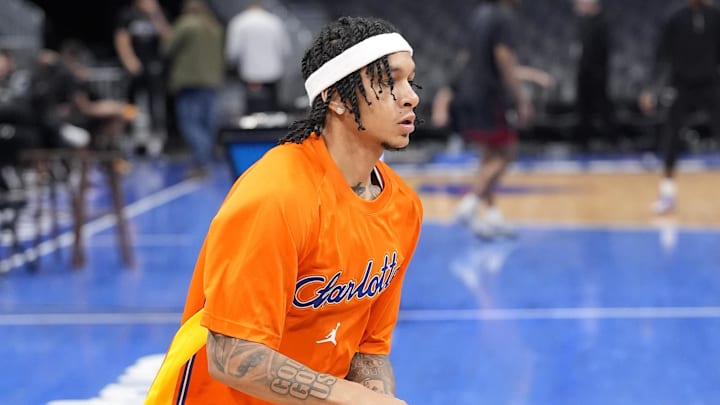 Jan 24, 2026; Charlotte, North Carolina, USA; Charlotte Hornets guard Tre Mann (23) shoots  during warm ups at the Spectrum Center. Mandatory Credit: Jim Dedmon-Imagn Images