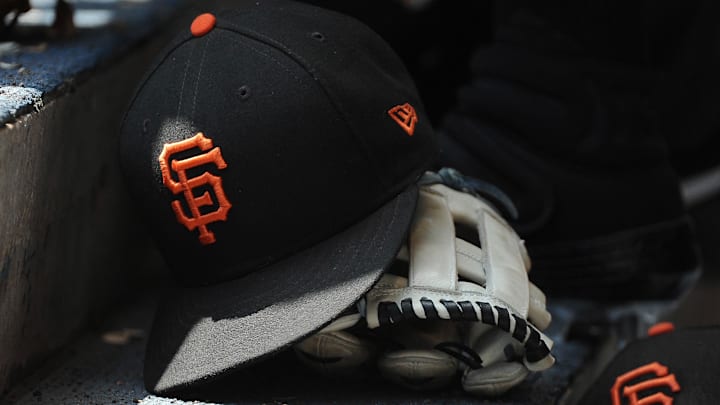 Jul 14, 2019; Milwaukee, WI, USA; San Francisco Giants hat and glove in the dug out at Miller Park. Jul 14, 2019; Milwaukee, WI, USA; San Francisco Giants hat and glove in the dug out at Miller Park.