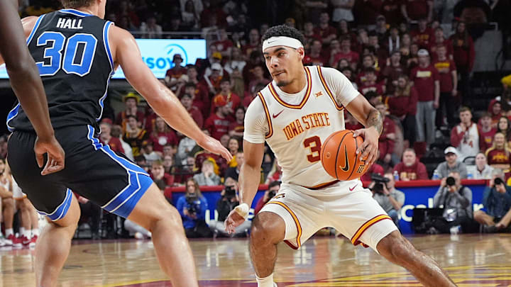Iowa State Cyclones guard Tamin Lipsey (3) drives with the ball around BYU Cougars's guard Dallin Hall (30) during the first half of the Big-12 men’s basketball in the Senior Day at Hilton Coliseum on March 4, 2025, in Ames, Iowa.