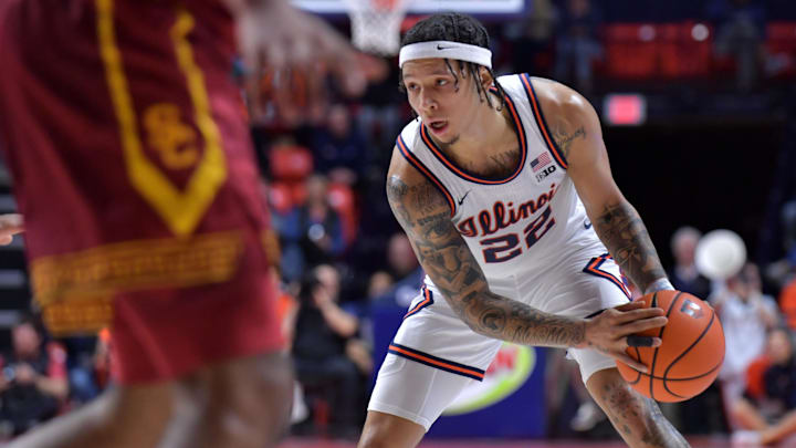 Jan 11, 2025; Champaign, Illinois, USA;  Illinois Fighting Illini guard Tre White (22) controls the ball during the first half against the USC Trojans at State Farm Center. Mandatory Credit: Ron Johnson-Imagn Images