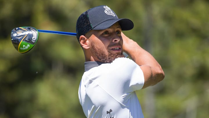 Steph Curry swings during the American Century Championship at Edgewood Tahoe Golf Course in