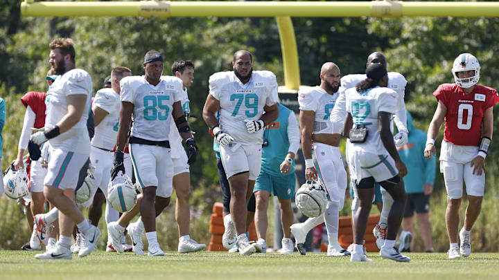 Miami Dolphins offensive tackle Larry Borom (79) walks on the field during joint training camp practice with the Chicago Bears ahead of Sunday's preseason opener. Miami Dolphins offensive tackle Larry Borom (79) walks on the field during joint training camp practice with the Chicago Bears ahead of Sunday's preseason opener.