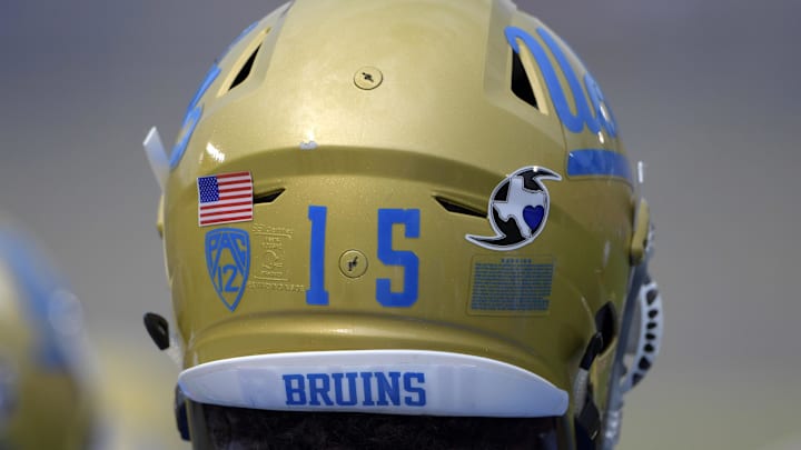 Sep 3, 2017; Pasadena, CA, USA; UCLA Bruins defensive lineman Jaelan Phillips (15) wears Hurricane Harvey sticker on helmet during a NCAA football game against the Texas A&M Aggies at Rose Bowl. The sticker features the state of Texas inside the symbol for a hurricane and a heart over where Houston is located on the state map. Mandatory Credit: Kirby Lee-Imagn Images