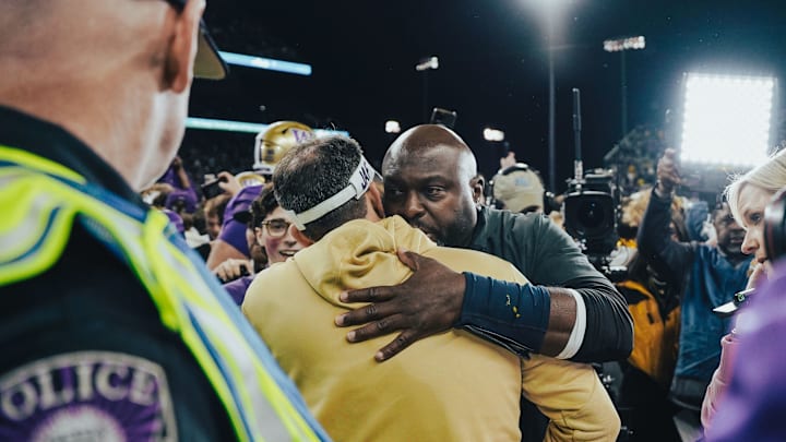 Jedd Fisch and Sherrone Moore greet each other after the UW-Michigan game. 