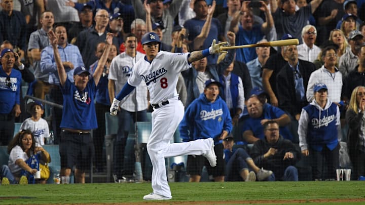 Oct 26, 2018; Los Angeles, CA, USA; Los Angeles Dodgers shortstop Manny Machado (8) hits a single in the sixth inning against the Boston Red Sox in game three of the 2018 World Series at Dodger Stadium. Mandatory Credit: Jayne Kamin-Oncea-Imagn Images Oct 26, 2018; Los Angeles, CA, USA; Los Angeles Dodgers shortstop Manny Machado (8) hits a single in the sixth inning against the Boston Red Sox in game three of the 2018 World Series at Dodger Stadium. Mandatory Credit: Jayne Kamin-Oncea-Imagn Images