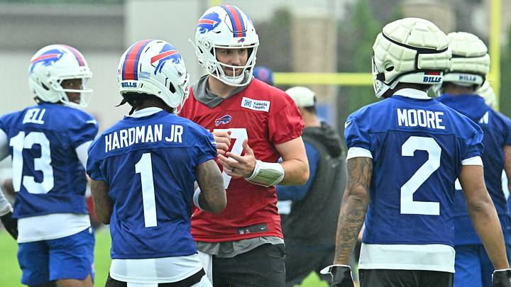 Buffalo Bills quarterback Josh Allen (17) talks with wide receivers Mecole Hardman (1) and DJ Moore (2) during training camp at St. John Fisher University. Mandatory Credit: Mark Konezny-Imagn Images