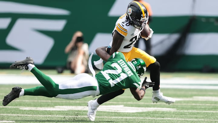 Sep 7, 2025; East Rutherford, New Jersey, USA; Pittsburgh Steelers running back Kaleb Johnson (20) breaks a tackle by New York Jets cornerback Brandon Stephens (21) during the third quarter at MetLife Stadium. Mandatory Credit: Vincent Carchietta-Imagn Images Sep 7, 2025; East Rutherford, New Jersey, USA; Pittsburgh Steelers running back Kaleb Johnson (20) breaks a tackle by New York Jets cornerback Brandon Stephens (21) during the third quarter at MetLife Stadium. Mandatory Credit: Vincent Carchietta-Imagn Images