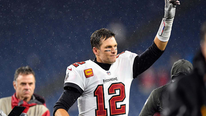 Oct 3, 2021; Foxborough, Massachusetts, USA; Tampa Bay Buccaneers quarterback Tom Brady (12) reacts as he runs off of the field after a game against the New England Patriots at Gillette Stadium. Mandatory Credit: Brian Fluharty-Imagn Images