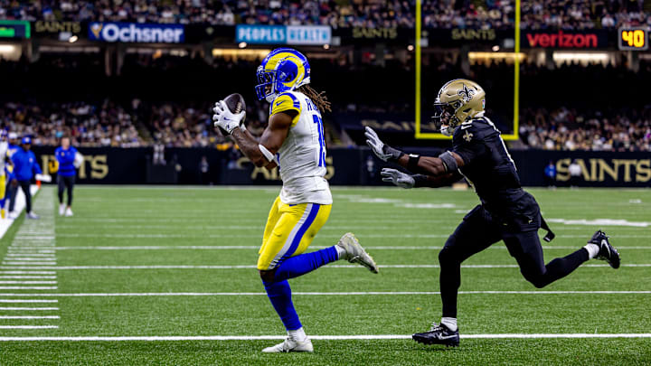 Dec 1, 2024; New Orleans, Louisiana, USA; Los Angeles Rams wide receiver Demarcus Robinson (15) catches a touchdown pass from quarterback Matthew Stafford (9) against the New Orleans Saints during the second half at Caesars Superdome. Mandatory Credit: Stephen Lew-Imagn Images Dec 1, 2024; New Orleans, Louisiana, USA; Los Angeles Rams wide receiver Demarcus Robinson (15) catches a touchdown pass from quarterback Matthew Stafford (9) against the New Orleans Saints during the second half at Caesars Superdome. Mandatory Credit: Stephen Lew-Imagn Images