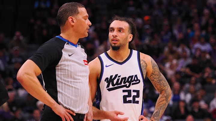 Mar 19, 2025; Sacramento, California, USA; Sacramento Kings guard Devin Carter (22) speaks with referee Nate Green during the fourth quarter against the Cleveland Cavaliers at Golden 1 Center. Mandatory Credit: Kelley L Cox-Imagn Images Mar 19, 2025; Sacramento, California, USA; Sacramento Kings guard Devin Carter (22) speaks with referee Nate Green during the fourth quarter against the Cleveland Cavaliers at Golden 1 Center. Mandatory Credit: Kelley L Cox-Imagn Images