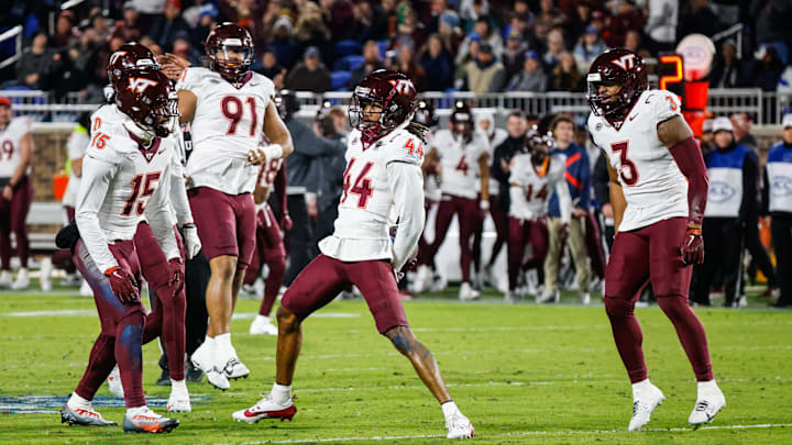 Nov 23, 2024; Durham, North Carolina, USA; Virginia Tech Hokies cornerback Dorian Strong (44) celebrates an interception with teammates during the second half of the game against Duke Blue Devils at Wallace Wade Stadium.