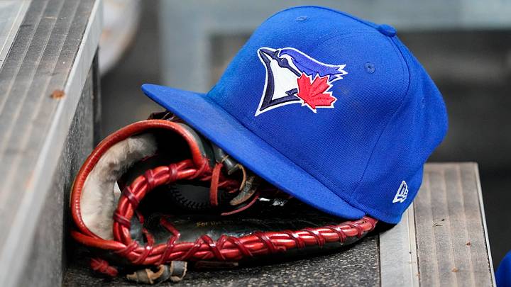 Toronto Blue Jays hat and glove. Credit: John E. Sokolowski-Imagn Images Toronto Blue Jays hat and glove. Credit: John E. Sokolowski-Imagn Images