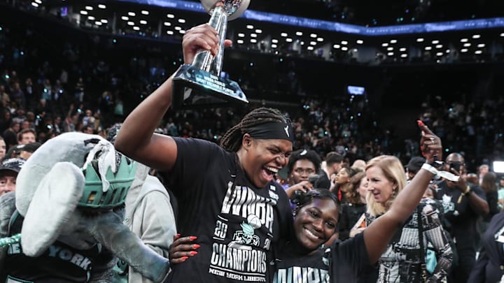 Oct 20, 2024; Brooklyn, New York, USA; New York Liberty forward Jonquel Jones (35) holds up the MVP trophy after defeating the Minnesota Lynx in overtime to win the 2024 WNBA Finals at Barclays Center. Mandatory Credit: Wendell Cruz-Imagn Images