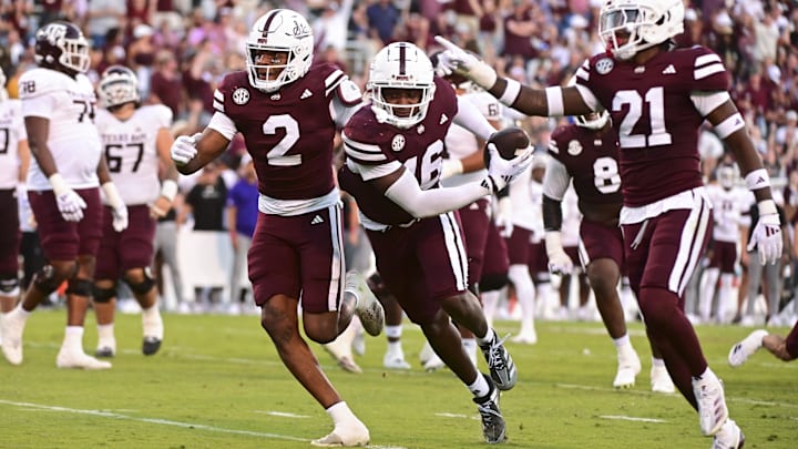 Oct 19, 2024; Starkville, Mississippi, USA; Mississippi State Bulldogs linebacker Zakari Tillman (16) reacts with teammates after an interception against the Texas A&M Aggies during the fourth quarter at Davis Wade Stadium at Scott Field. Mandatory Credit: Matt Bush-Imagn Images