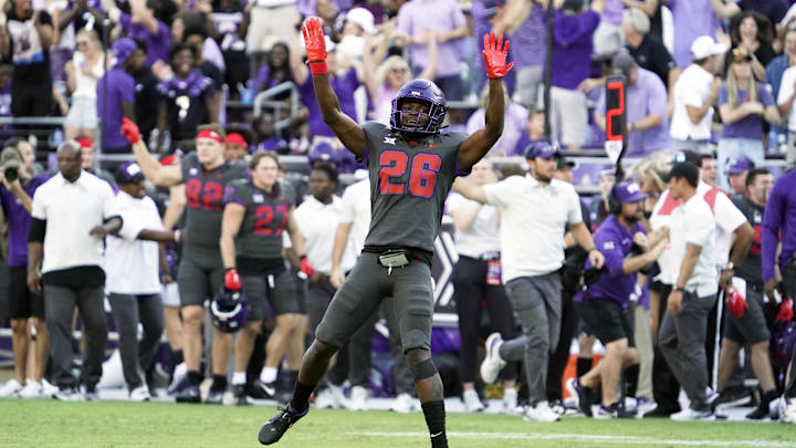 Oct 15, 2022; Fort Worth, Texas, USA; TCU Horned Frogs safety Bud Clark (26) celebrates his interception during the second half against the Oklahoma State Cowboys at Amon G. Carter Stadium. Mandatory Credit: Raymond Carlin III-Imagn Images