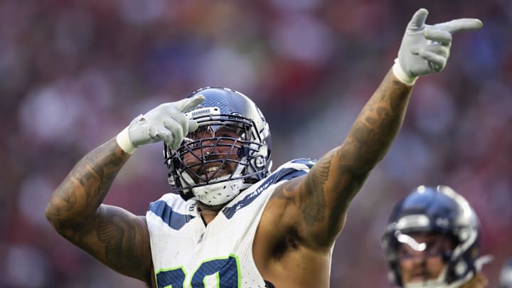 Dec 8, 2024; Glendale, Arizona, USA; Seattle Seahawks defensive end Leonard Williams (99) celebrates a tackle in the second half against the Arizona Cardinals at State Farm Stadium.