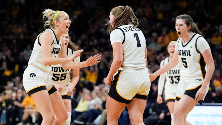 The Iowa Hawkeyes react as Iowa Hawkeyes guard Taylor Stremlow (1) goes to the free throw line Wednesday, Dec. 11, 2024 at Carver-Hawkeye Arena in Iowa City, Iowa.