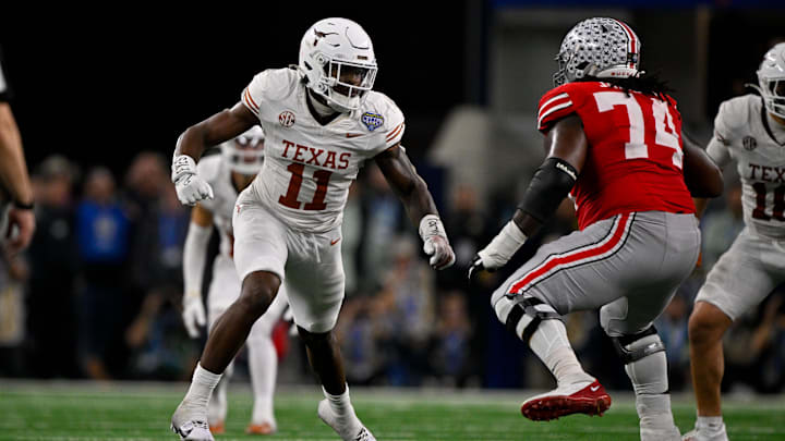 Jan 10, 2025; Arlington, TX, USA; Texas Longhorns linebacker Colin Simmons (11) and Ohio State Buckeyes offensive lineman Donovan Jackson (74) in action during the game between the Texas Longhorns and the Ohio State Buckeyes at AT&T Stadium. Mandatory Credit: Jerome Miron-Imagn Images