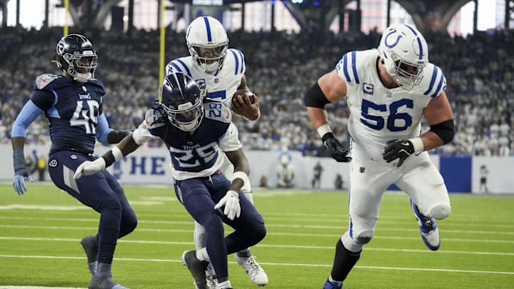 Dec 22, 2024; Indianapolis, Indiana, USA; Indianapolis Colts quarterback Anthony Richardson (5) rushes for a touchdown behind Indianapolis Colts guard Quenton Nelson (56) during a game against the Tennessee Titans at Lucas Oil Stadium. Mandatory Credit: Christine Tannous/USA Today Network via Imagn Images 