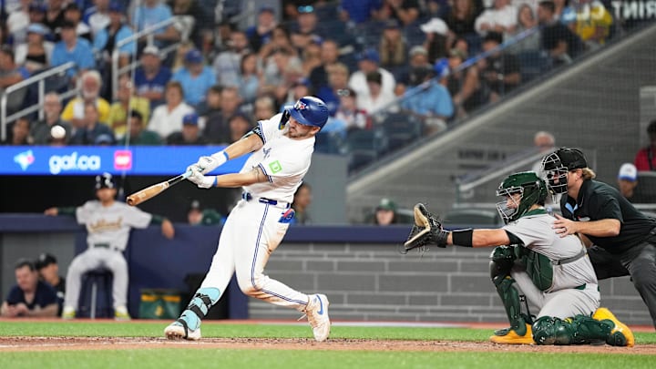 Toronto Blue Jays shortstop Spencer Horwitz (48) hits a home run against the Oakland Athletics during the eighth inning at Rogers Centre. 