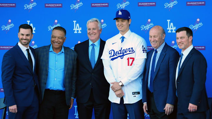 Dec 14, 2023; Los Angeles, CA, USA; From left Brandon Gomes, Dave Roberts, Mark Walter, Shohei Ohtani, Stan Kasten and Andrew Friedman pose for a photo at Ohtani's introductory press conference at Dodger Stadium. Dec 14, 2023; Los Angeles, CA, USA; From left Brandon Gomes, Dave Roberts, Mark Walter, Shohei Ohtani, Stan Kasten and Andrew Friedman pose for a photo at Ohtani's introductory press conference at Dodger Stadium.