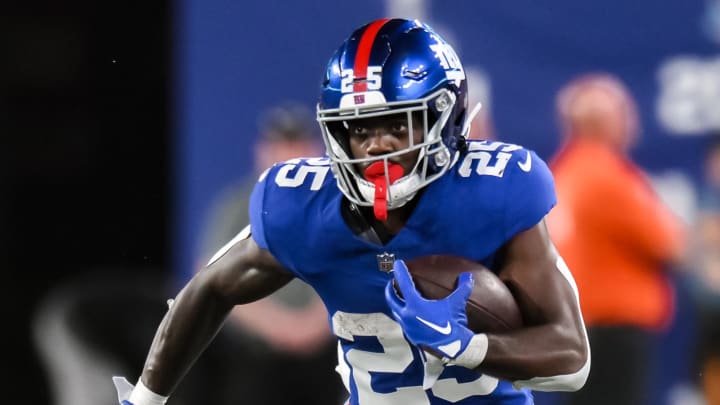 Aug 18, 2023; East Rutherford, New Jersey, USA; New York Giants running back Jashaun Corbin (25) runs after a catch against the Carolina Panthers during the fourth quarter at MetLife Stadium.  