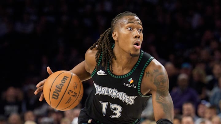 Apr 25, 2026; Minneapolis, Minnesota, USA; Minnesota Timberwolves guard Ayo Dosunmu (13) looks to drive to the basket against the Denver Nuggets in the second quarter at Target Center. Mandatory Credit: Matt Blewett-Imagn Images
