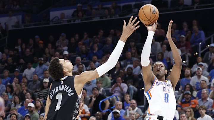 Oct 30, 2024; Oklahoma City, Oklahoma, USA; Oklahoma City Thunder forward Jalen Williams (8) shoots as San Antonio Spurs center Victor Wembanyama (1) defends during the second half at Paycom Center. Mandatory Credit: Alonzo Adams-Imagn Images