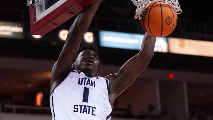 Feb 27, 2024; Fresno, California, USA; Utah State Aggies forward Great Osobor (1) dunks the ball.