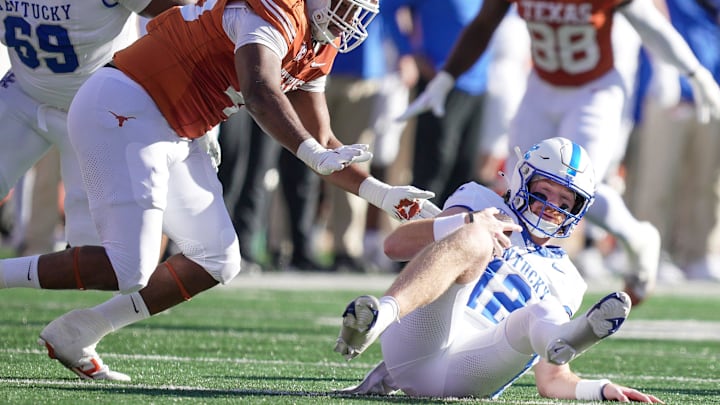 Texas Longhorns defensive lineman Vernon Broughton (45) sacks Kentucky Wildcats quarterback Brock Vandagriff (12) in the first quarter during the first half of an NCAA college football game at Darrell K Royal Texas Memorial Stadium, Austin, Texas, Saturday, Nov 24, 2024.
