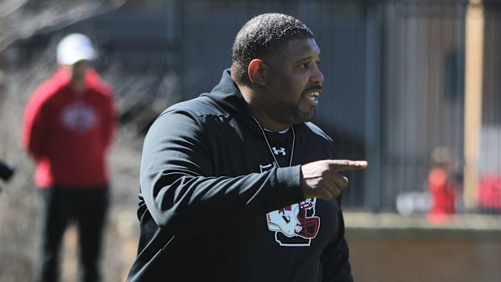 Wisconsin defensive line coach E.J. Whitlow gives instructions to his group during spring practice outside Camp Randall Stadium in Madison, Wisconsin on Saturday April 13, 2024.