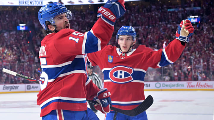 May 10, 2026; Montreal, Quebec, CAN; Montreal Canadiens forward Alex Newhook (15) celebrates with teammate defenseman Lane Hutson (48) after scoring a goal against the Buffalo Sabresduring the first period in game three of the second round of the 2026 Stanley Cup Playoffs at the Bell Centre. Mandatory Credit: Eric Bolte-Imagn Images