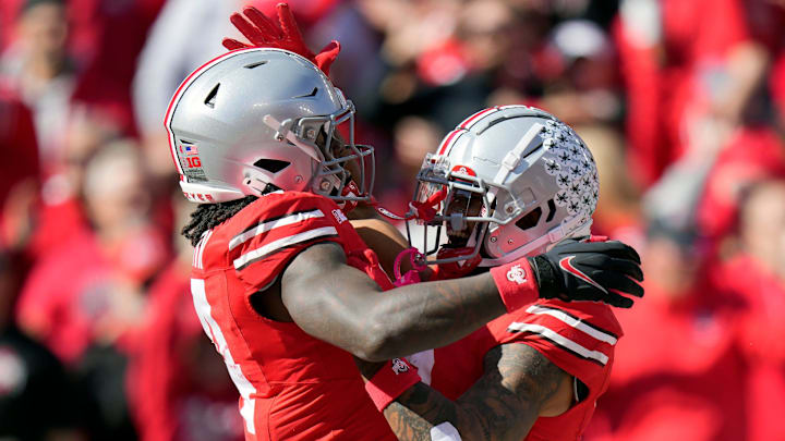 Ohio State Buckeyes wide receiver Jeremiah Smith (4) celebrates with Ohio State Buckeyes wide receiver Emeka Egbuka (2) after a touchdown catch against Nebraska Cornhuskers during the second quarter of their game at Ohio Stadium on Oct 26, 2024, in Columbus.