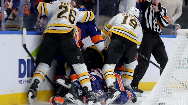 Nov 4, 2025; Elmont, New York, USA; New York Islanders and Boston Bruins players fight after a hit on New York Islanders defenseman Matthew Schaefer (48) by Boston Bruins defenseman Nikita Zadorov (91) during the second period at UBS Arena. Mandatory Credit: Brad Penner-Imagn Images