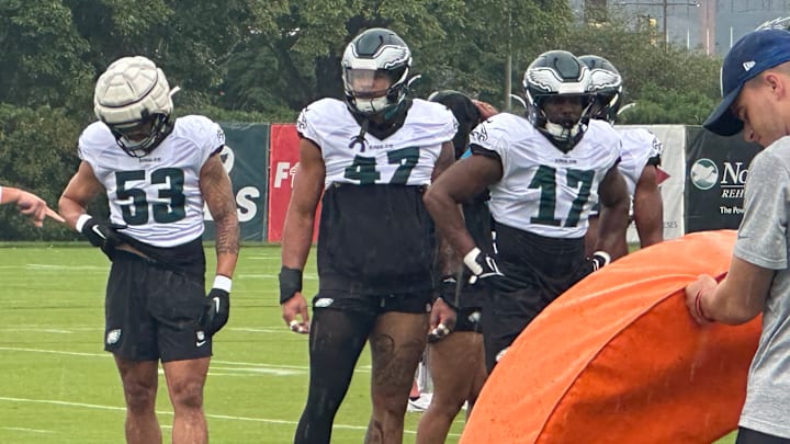 Eagles prep for tackling drill during training camp. From left to right: Zack Baun, Brandon Smith, and Nakobe Dean Eagles prep for tackling drill during training camp. From left to right: Zack Baun, Brandon Smith, and Nakobe Dean