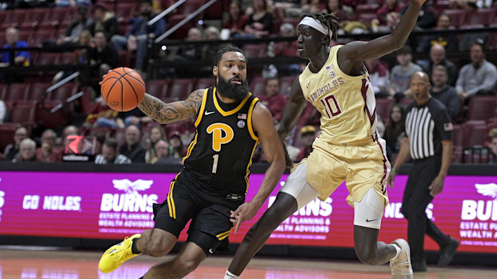 Jan 15, 2025; Tallahassee, Florida, USA; Pittsburgh Panthers guard Damian Dunn (1) drives to the net past Florida State Seminoles forward Taylor Bol Bowen (10) during the first half at Donald L. Tucker Center. Mandatory Credit: Melina Myers-Imagn Images Jan 15, 2025; Tallahassee, Florida, USA; Pittsburgh Panthers guard Damian Dunn (1) drives to the net past Florida State Seminoles forward Taylor Bol Bowen (10) during the first half at Donald L. Tucker Center. Mandatory Credit: Melina Myers-Imagn Images