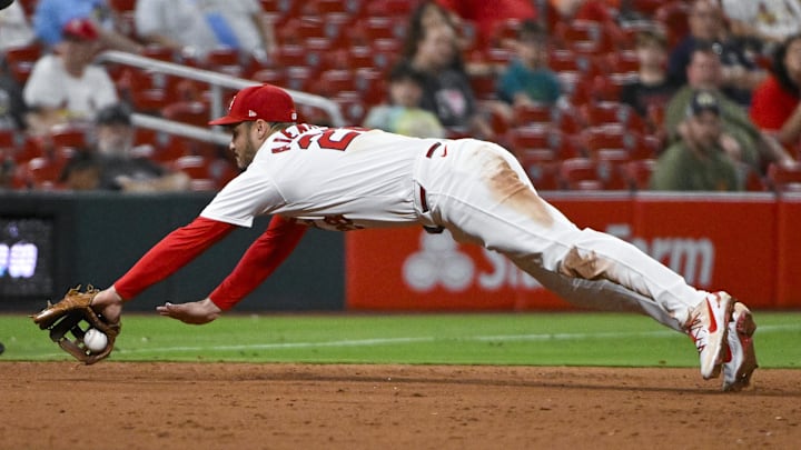 Sep 18, 2024; St. Louis, Missouri, USA; St. Louis Cardinals third baseman Nolan Arenado (28) dives but is unable to field a ground ball hit by Pittsburgh Pirates center fielder Billy Cook (not pictured) during the ninth inning at Busch Stadium. Mandatory Credit: Jeff Curry-Imagn Images Sep 18, 2024; St. Louis, Missouri, USA; St. Louis Cardinals third baseman Nolan Arenado (28) dives but is unable to field a ground ball hit by Pittsburgh Pirates center fielder Billy Cook (not pictured) during the ninth inning at Busch Stadium. Mandatory Credit: Jeff Curry-Imagn Images