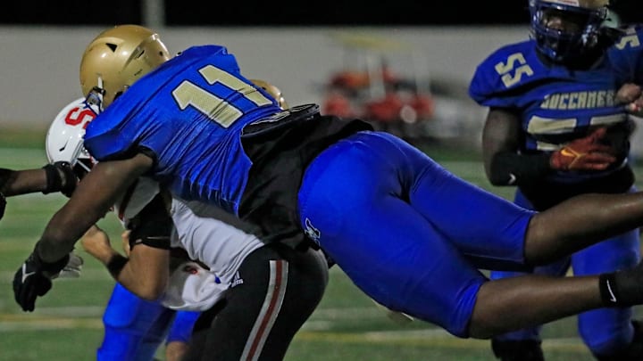 Mainland   s LJ Mccray (11) sacks Satellites Ethan Rafaele (9) quarterback during the playoff game