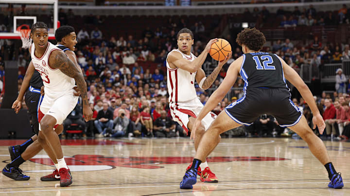 Nov 27, 2025; Chicago, Illinois, USA; Arkansas Razorbacks guard Darius Acuff Jr. (5) looks to pass the ball against Duke Blue Devils during the first half at United Center. Mandatory Credit: Kamil Krzaczynski-Imagn Images