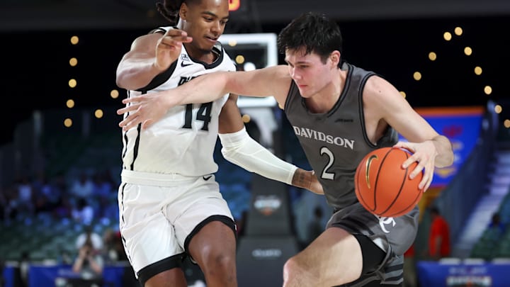 Nov 28, 2024;  Paradise Island, Bahamas, BHS; Davidson Wildcats forward Bobby Durkin (2) drives to the basket as Providence Friars guard Corey Floyd Jr. (14) defends during the second half at the Imperial Arena at the Atlantis Resort.  Mandatory Credit: Kevin Jairaj-Imagn Images