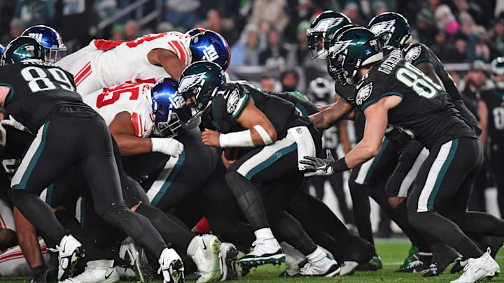 Dec 25, 2023; Philadelphia, Pennsylvania, USA; Philadelphia Eagles quarterback Jalen Hurts (1) picks up a first down during the third quarter against the New York Giants at Lincoln Financial Field. Mandatory Credit: Eric Hartline-Imagn Images